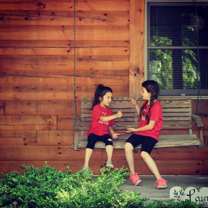 Kids on Swing on Cabin Porch