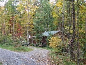 Laurel Cabin Outside with Fall Leaves